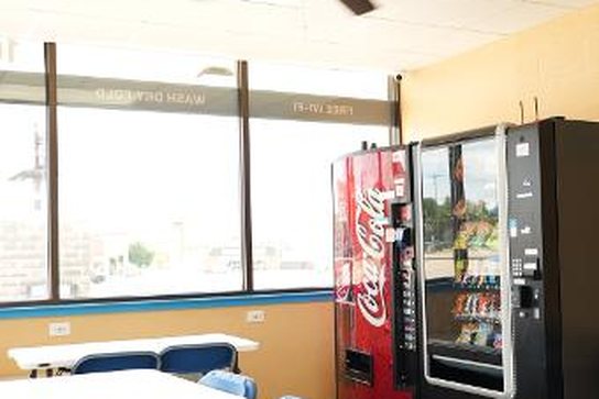 WaveMAX Temple, TX — Olaf Dr. | WaveMAX Laundry 22 Seating and vending area at the Olaf Drive laundromat in Temple, TX